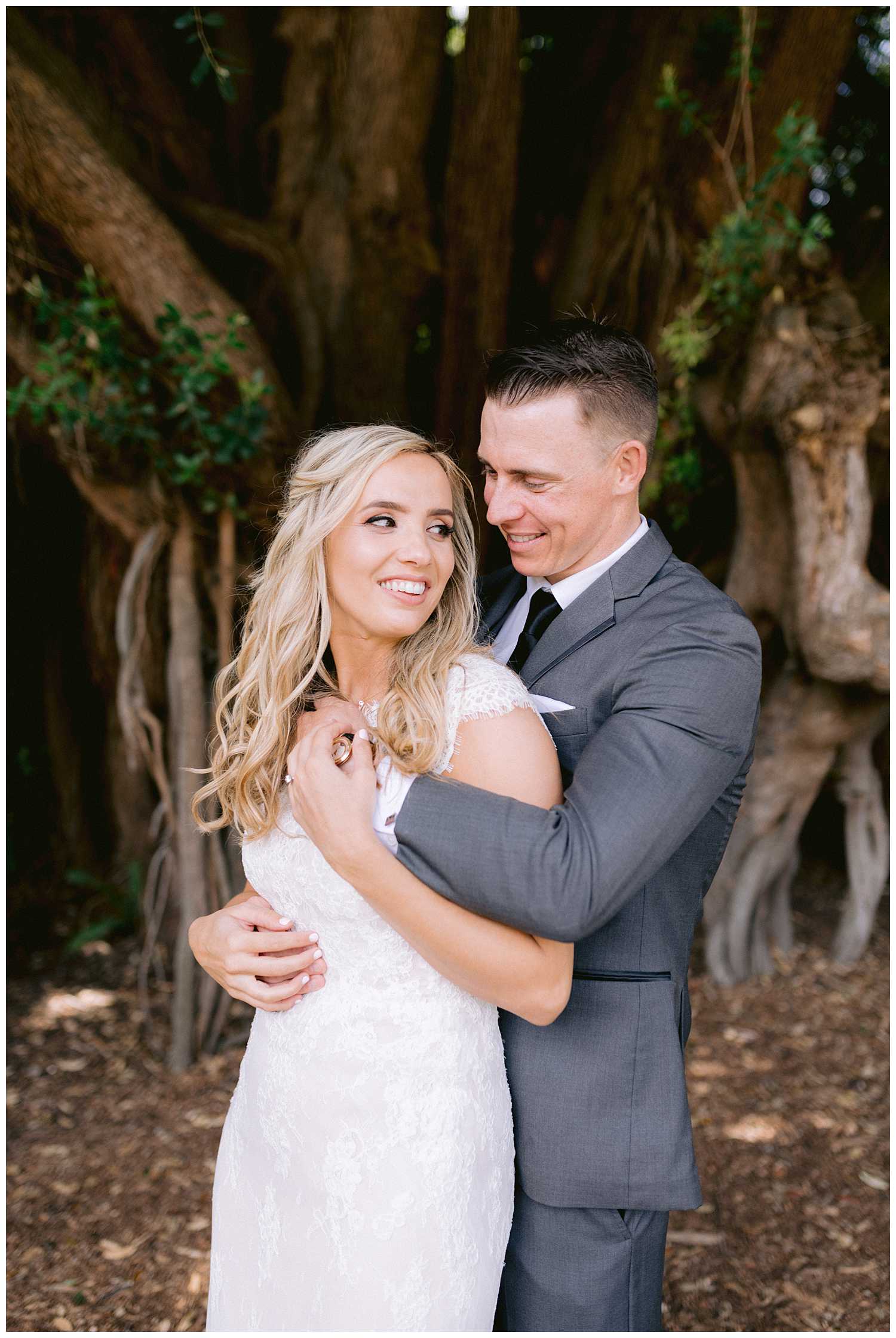 Kelsey and Mitchell embrace at their botanical garden elopement