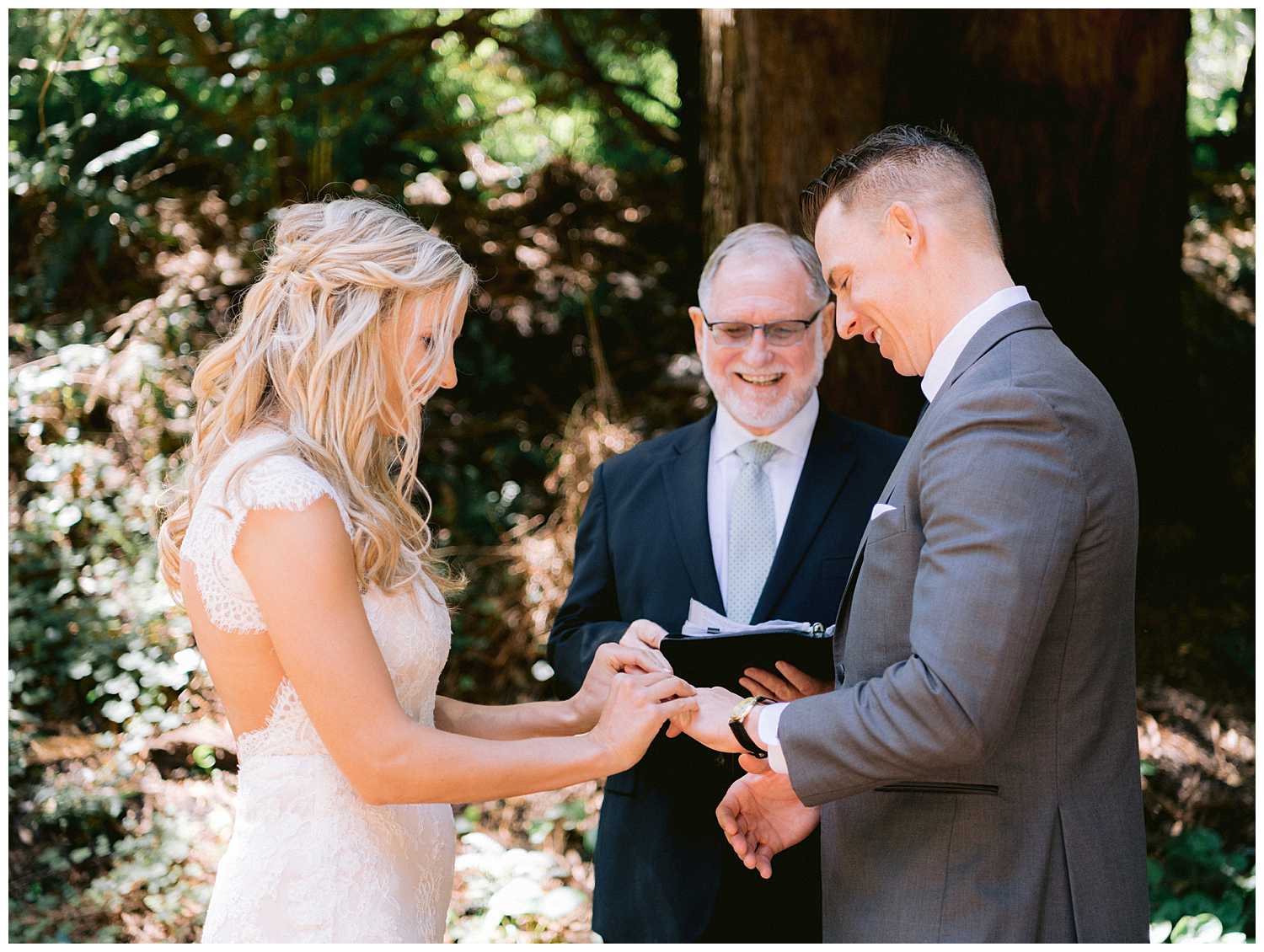 Kelsey placing Mitchell's wedding band on his ring finger