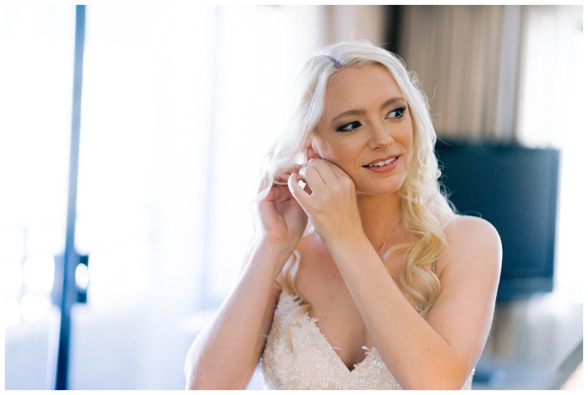 Alyssa putting on her bridal jewelry