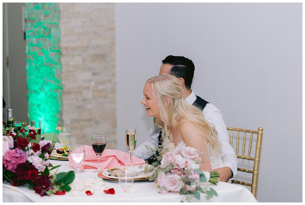Alyssa and Niv laughing at wedding speech