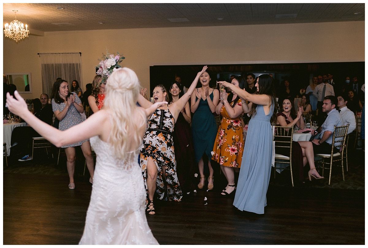 celebrating catching the wedding bouquet
