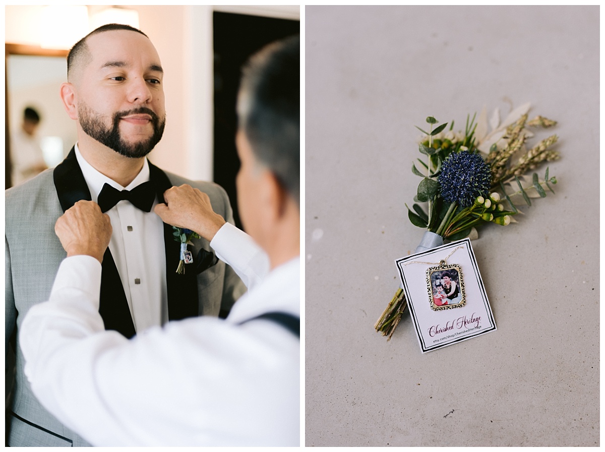 Groom putting on bowtie, boutonniere and custom family charm