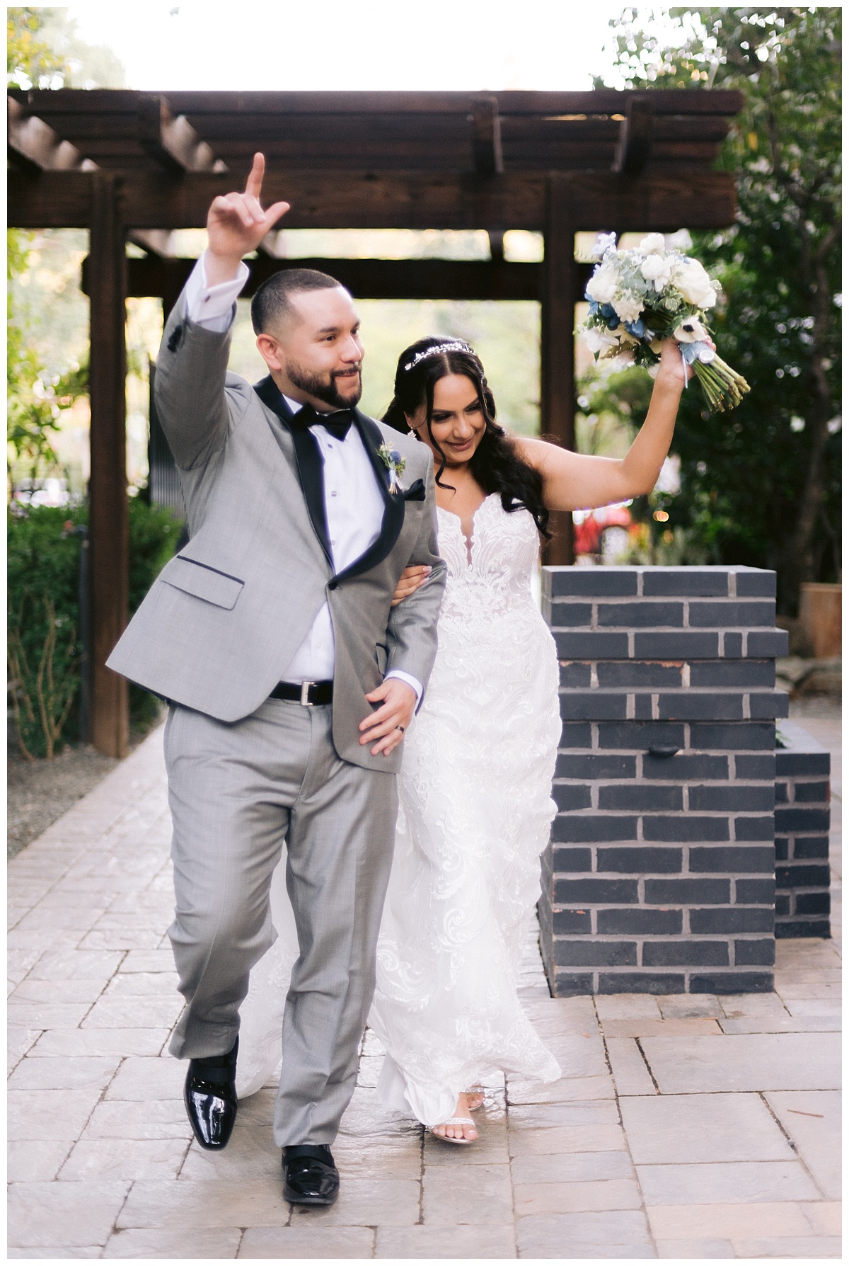 Bride and groom entering their wedding reception