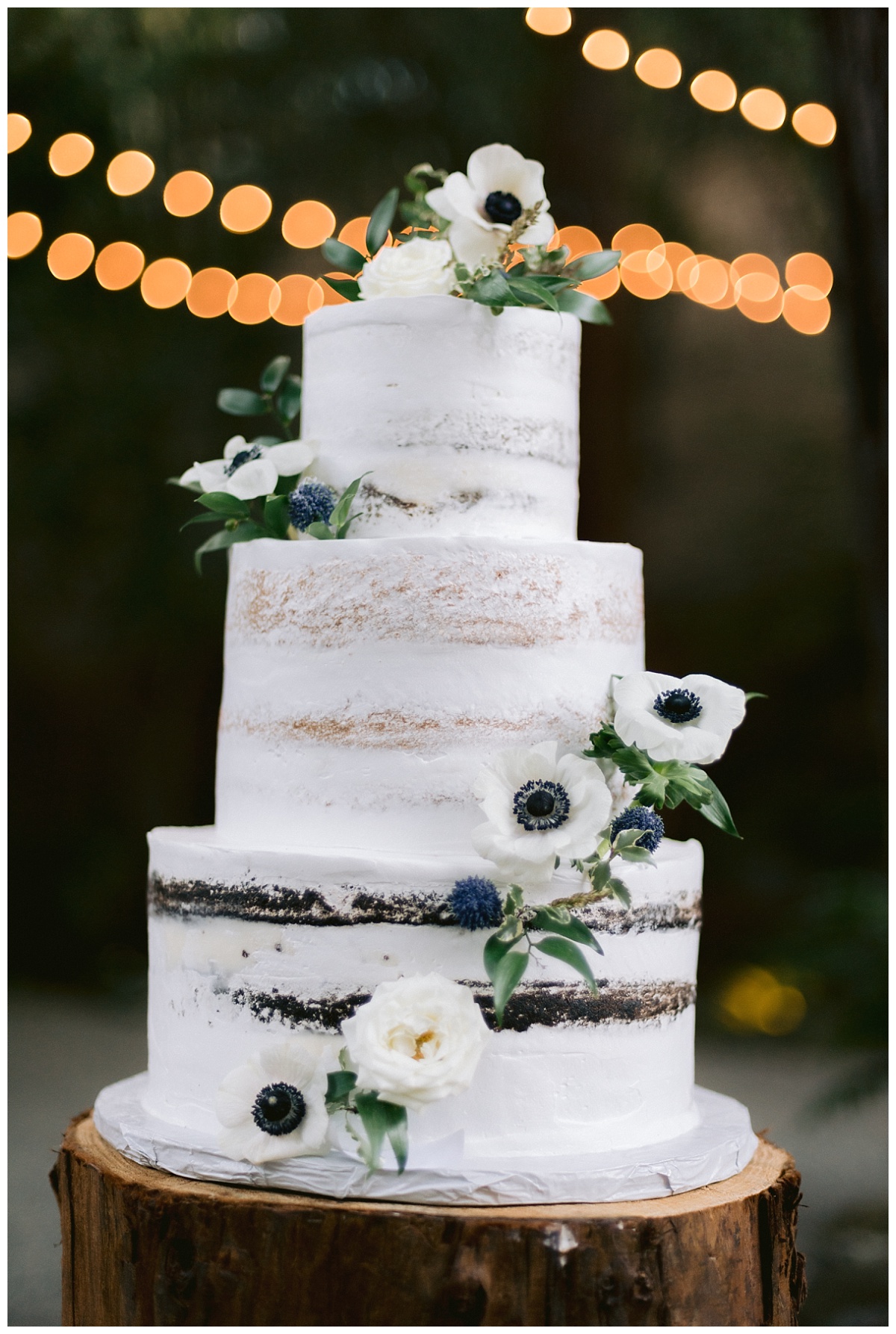Wedding cake decorated with fresh flowers