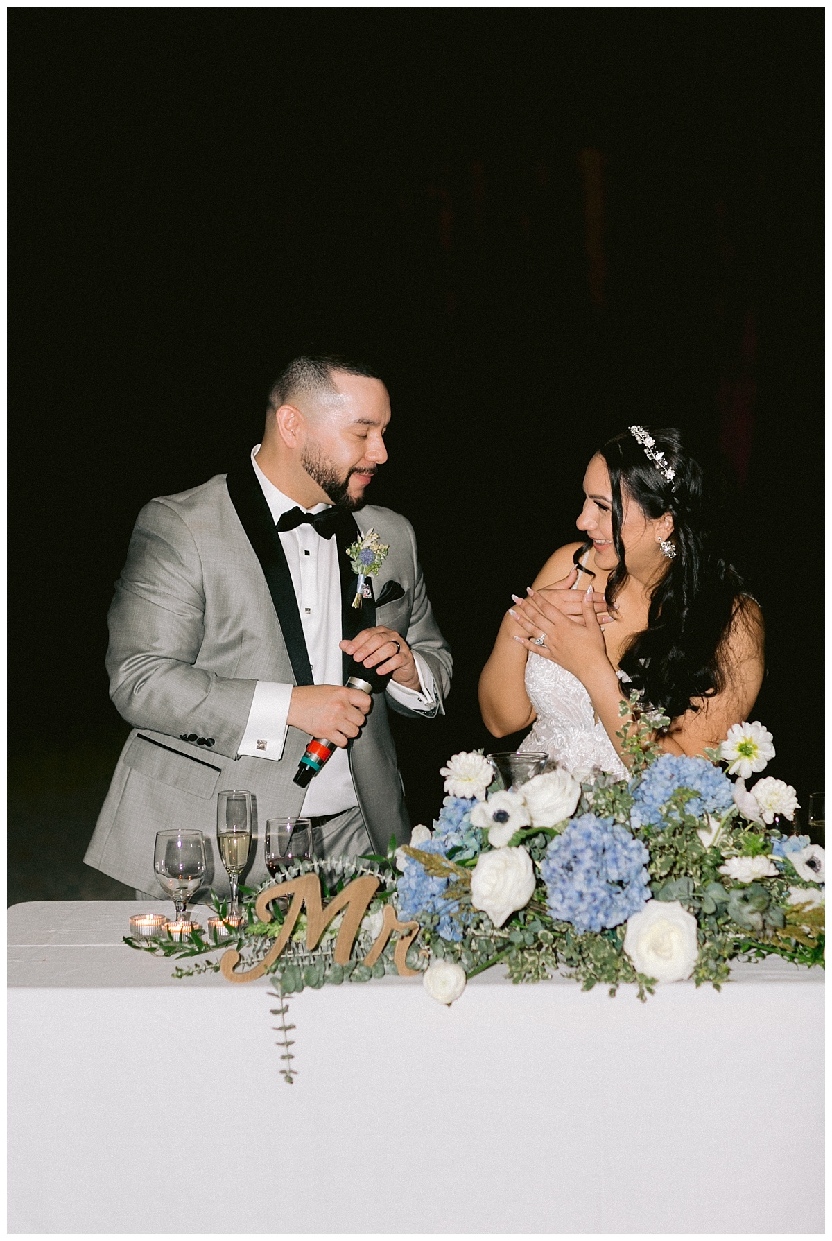 Liliana and Cesar laughing during speeches
