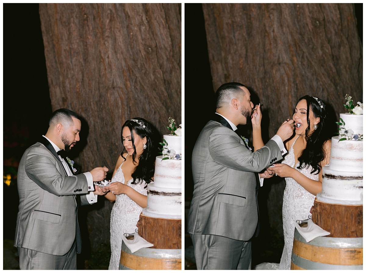 Bride and groom feed each other wedding cake