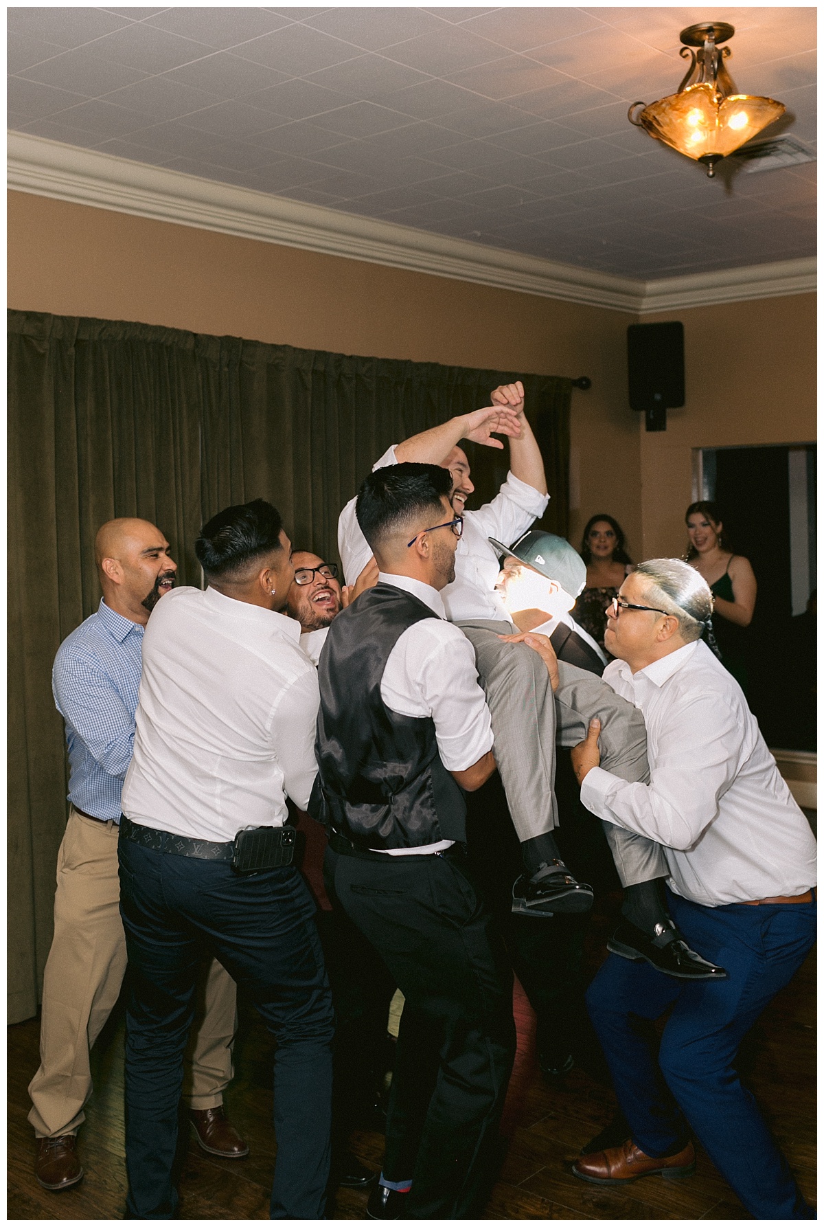Friends lift the groom up