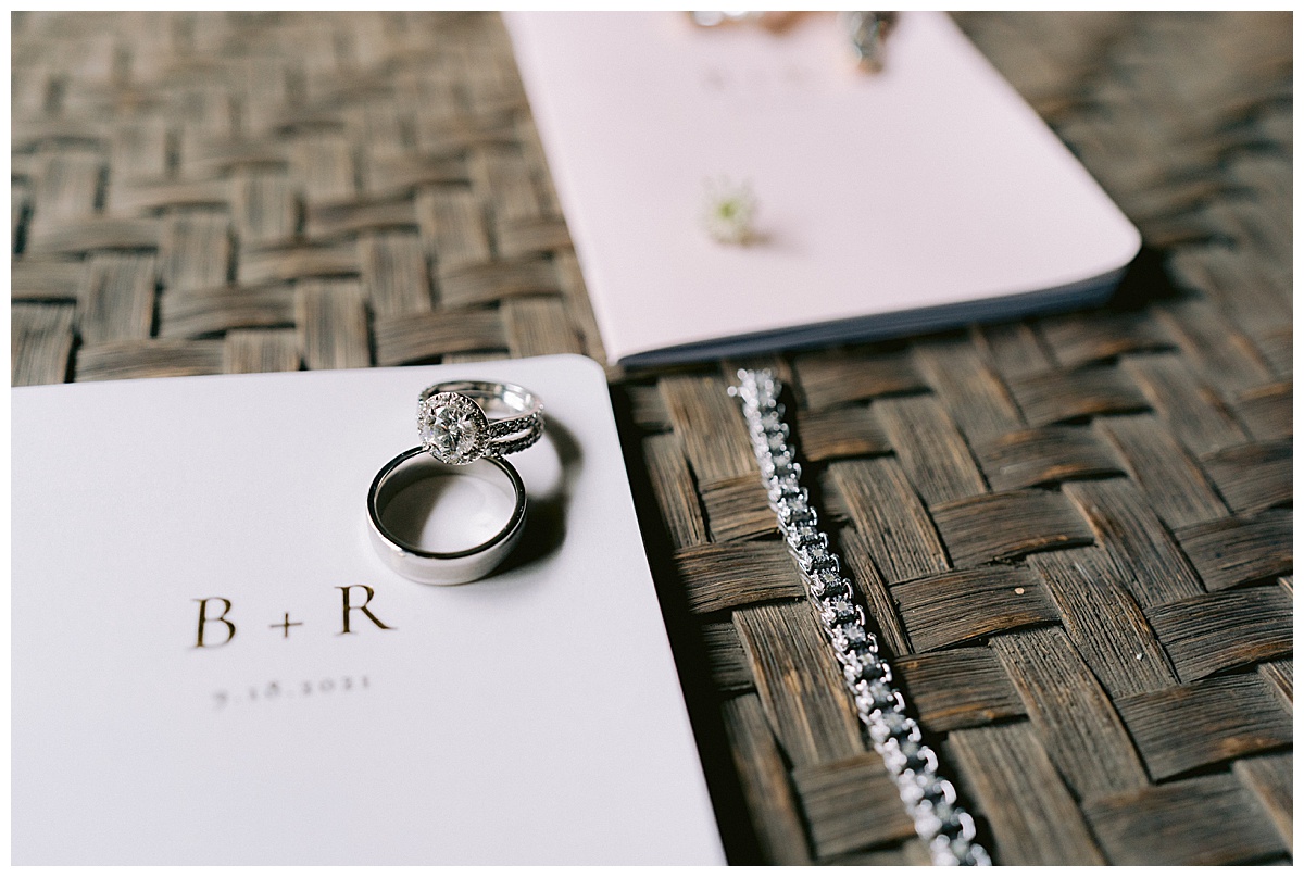 Vow booklets, wedding rings, and bridal jewelry for Brianna and Ryan's Half Moon Bay Elopement