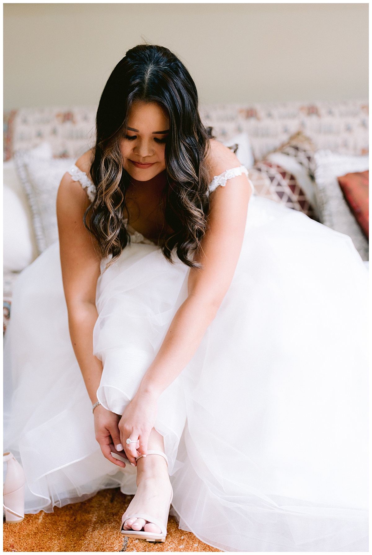 Brianna putting on her wedding shoes