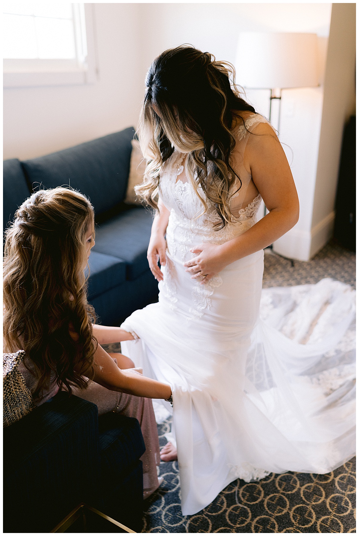 Keyla putting on her bridal gown