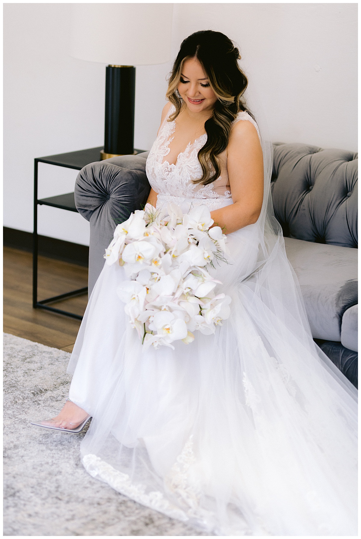 Keyla with her bridal bouquet of white orchids