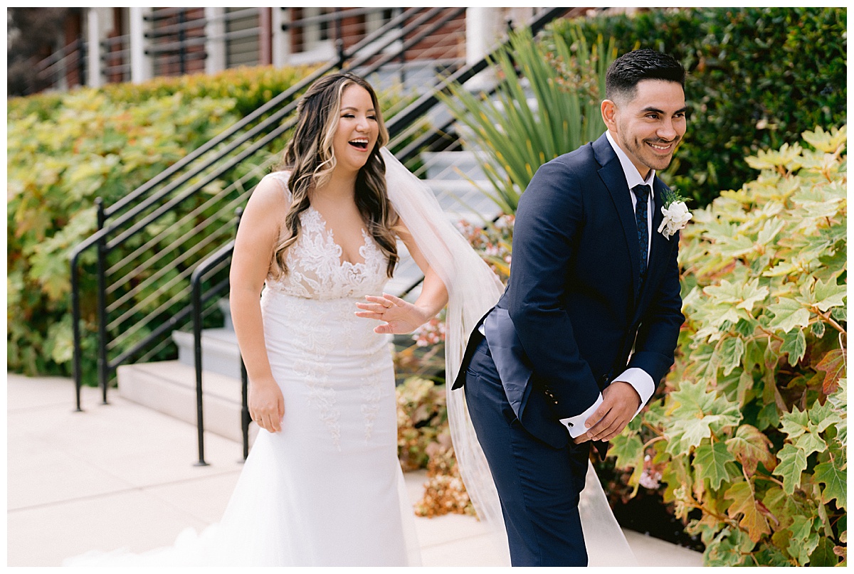 Keyla gets ready to smack Renato's behind before their first look, laughing