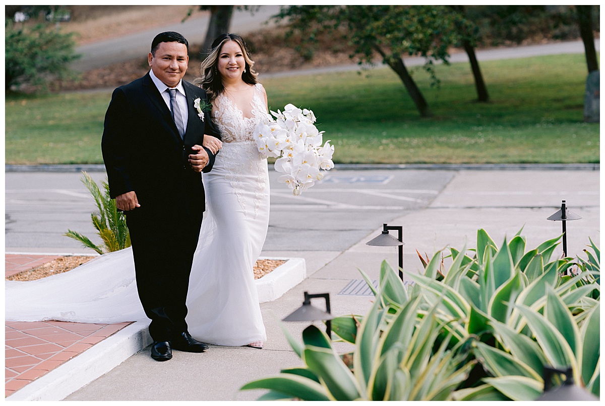 Keyla makes her way down the aisle at the Golden Gate Club wedding ceremony