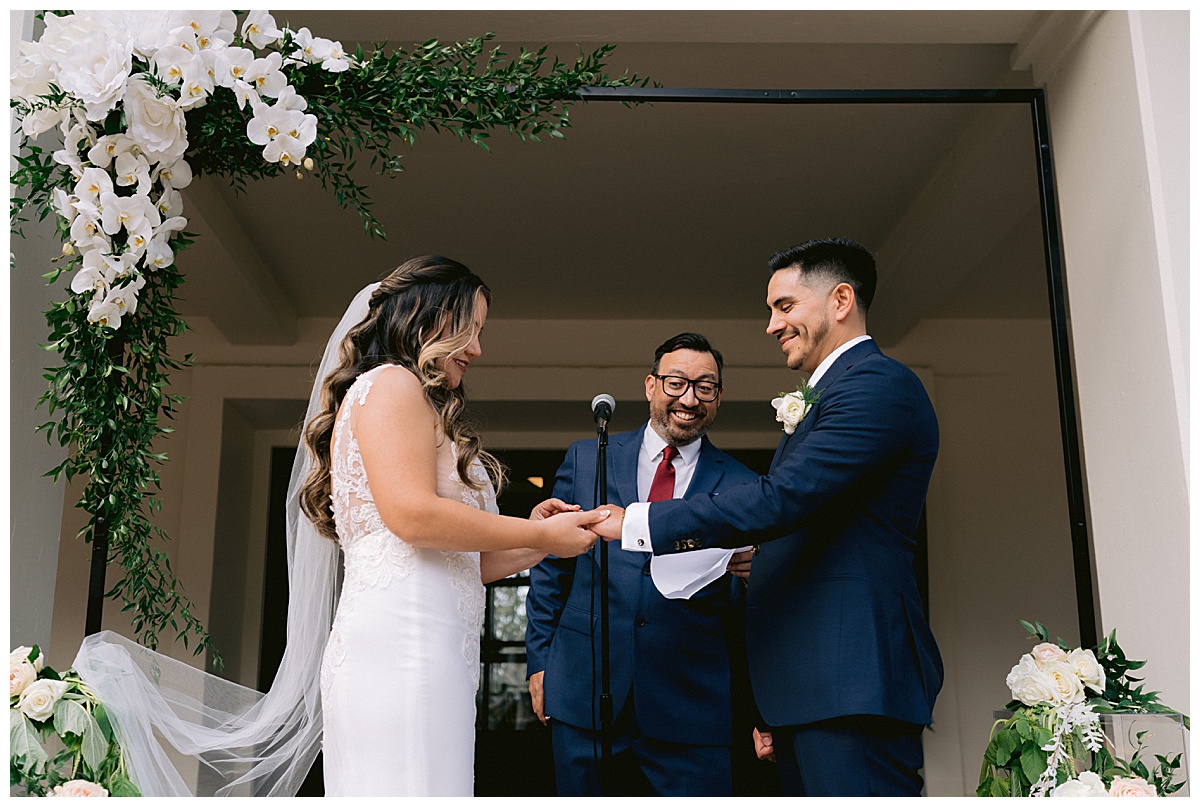 Keyla places Renato's ring on his finger