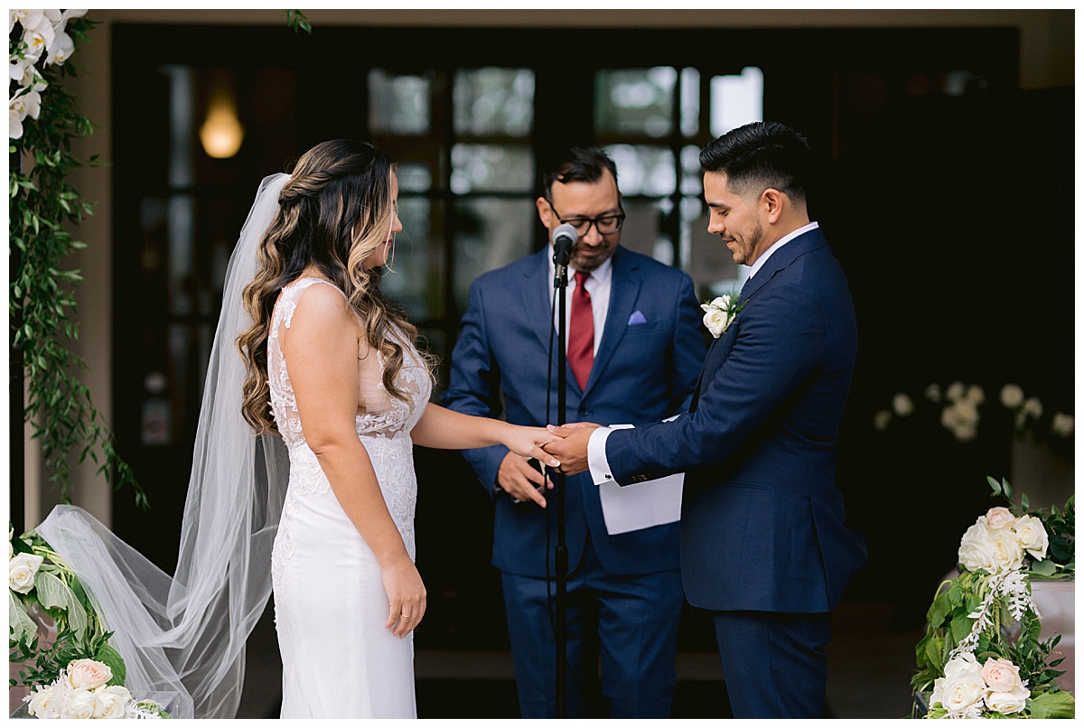 Renato places Keyla's wedding ring on her finger