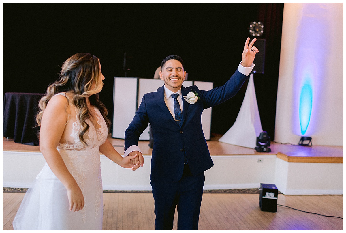 Keyla and Renato entering their wedding reception