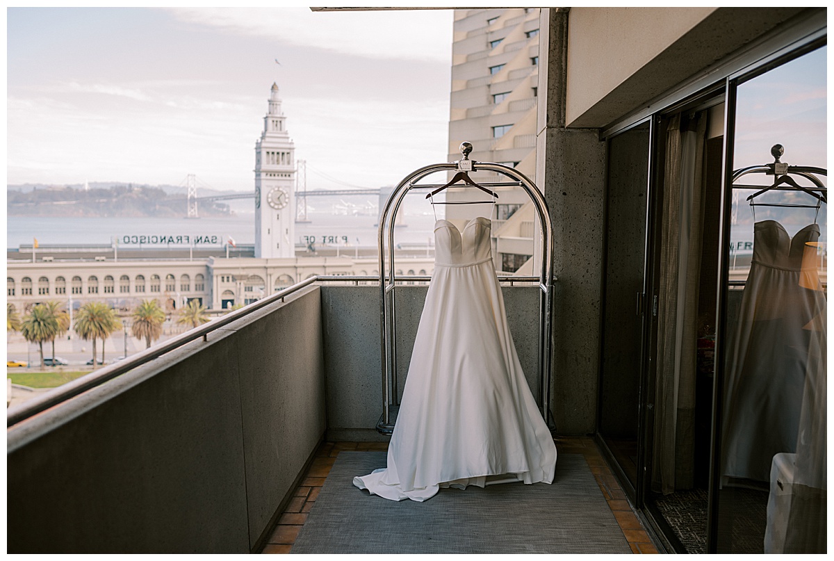 Susie's wedding dress with San Francisco Bay in the background