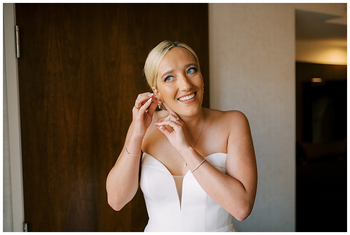 Susie putting on her jewelry for the Golden Gate Club wedding ceremony
