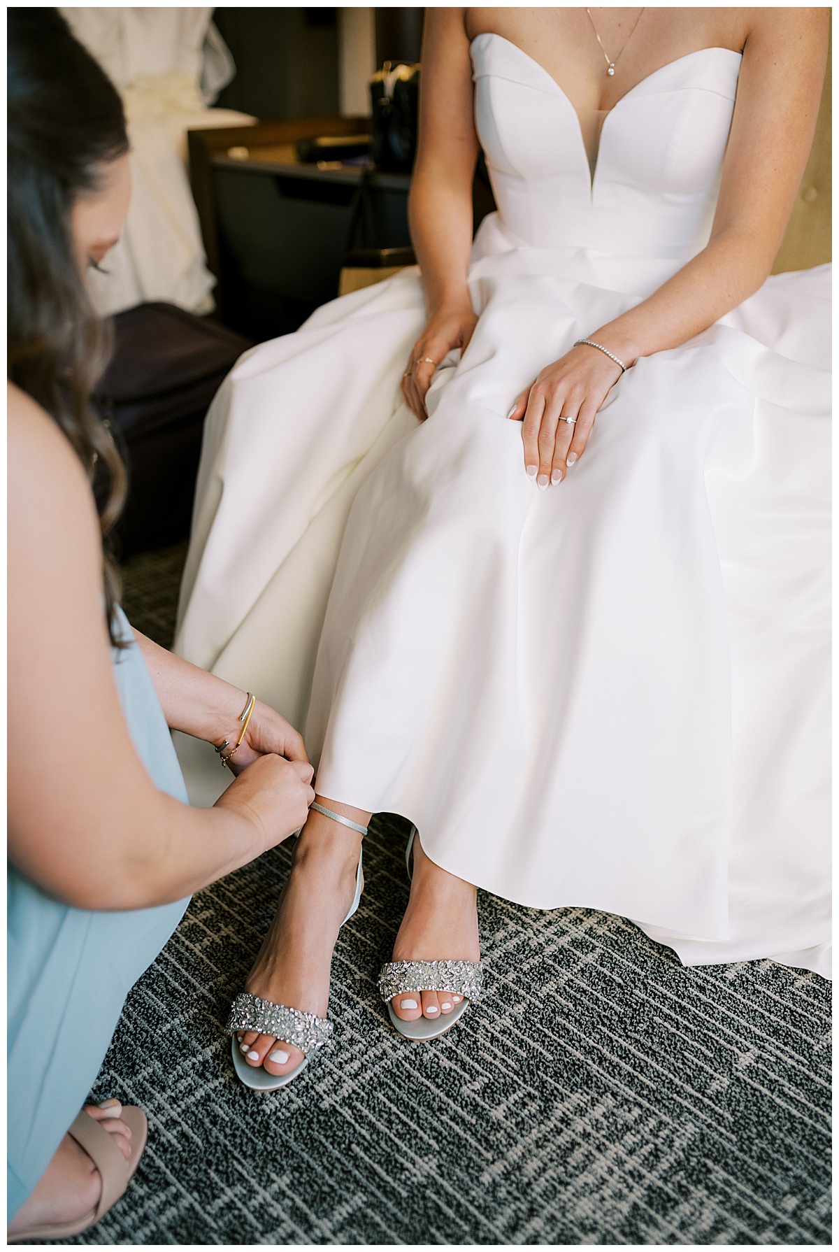 Susie putting on her bridal shoes for the Golden Gate Club wedding ceremony