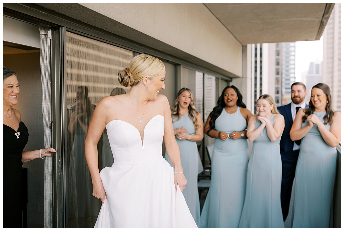 Susie showing off her dress to her bridal party