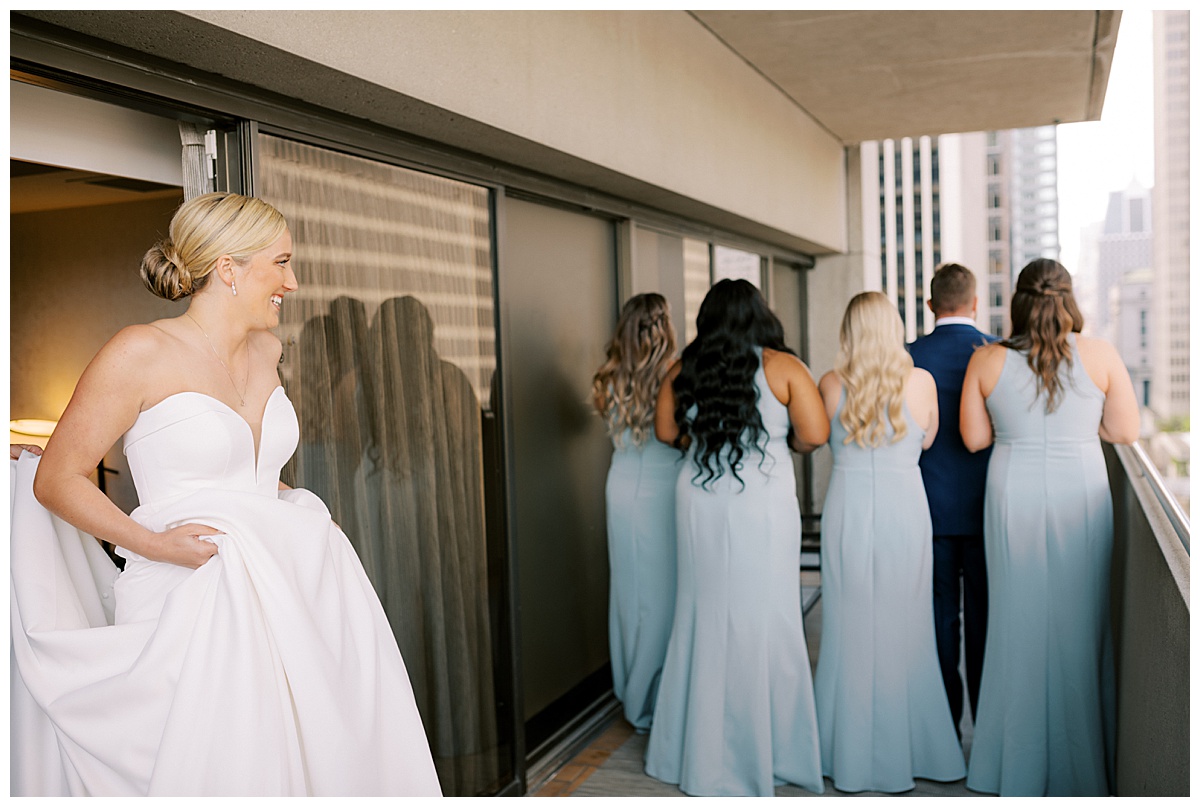 Susie having a first look with her bridal party