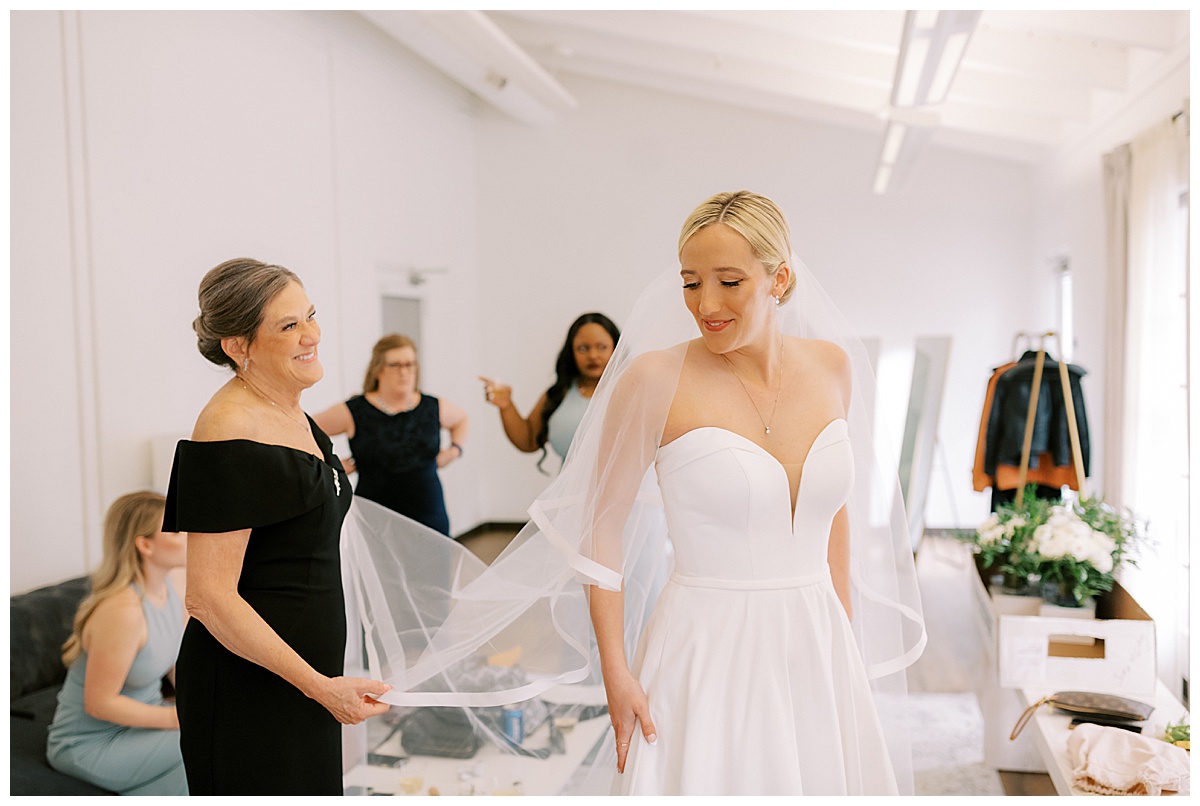 Susie in her wedding dress with her bridal veil before the Golden Gate Club wedding