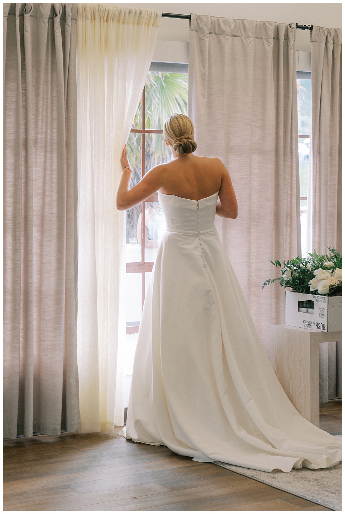 Susie peaking out the window before her and Devon's first look