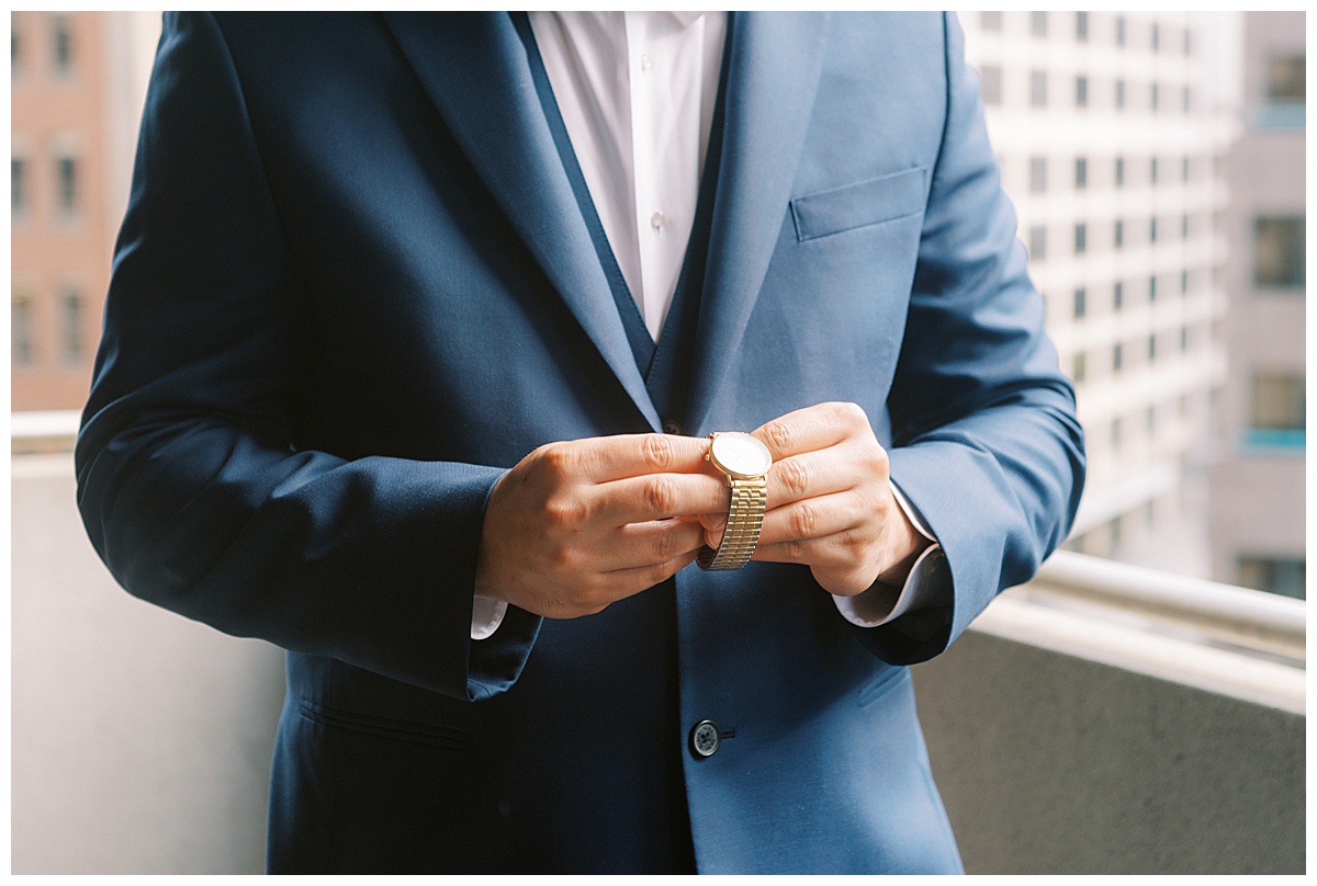 Devon putting on his watch for the Golden Gate Club wedding ceremony