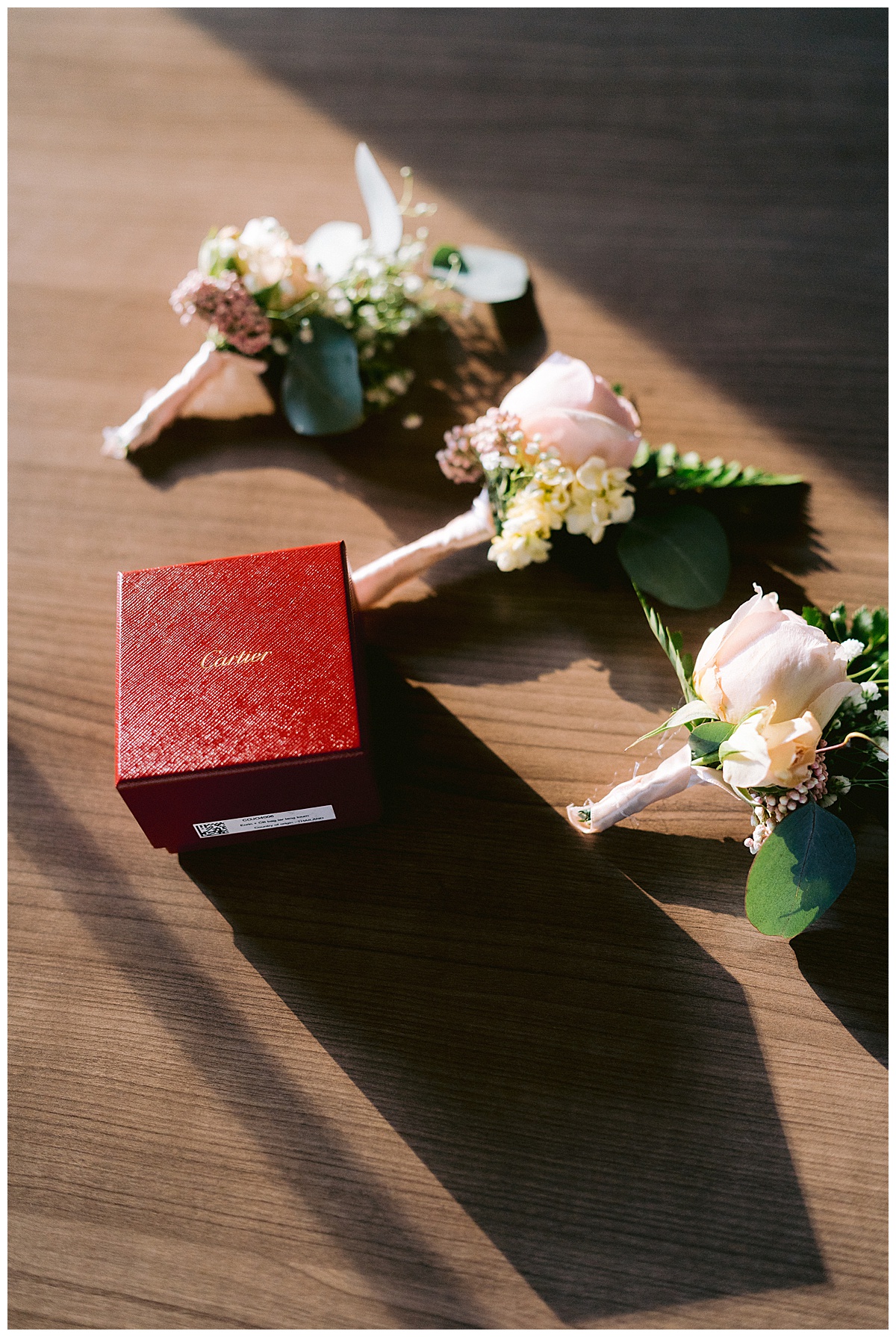 Boutonnieres and Cartier ring box for the outdoor Presidio Chapel wedding