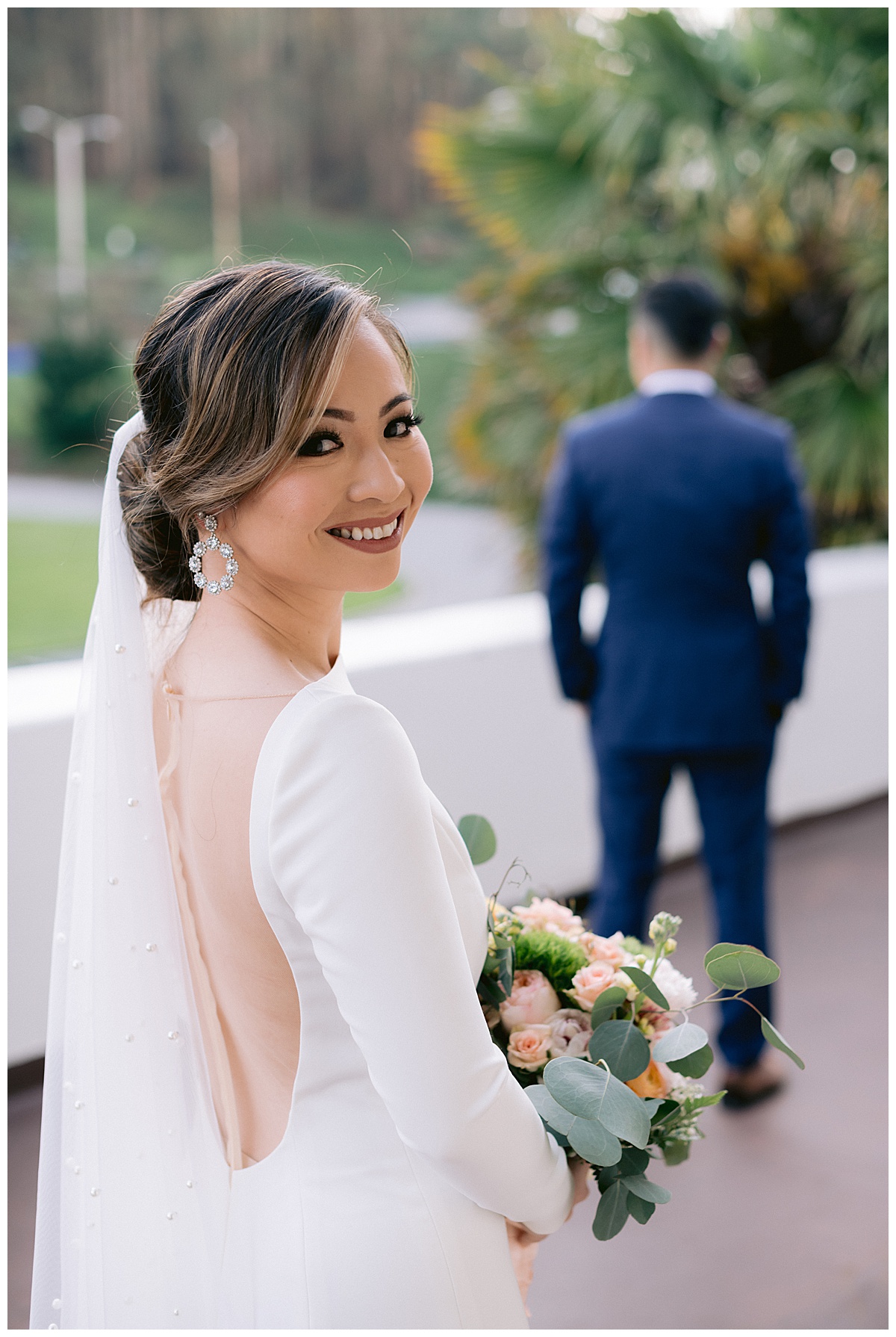Vivian approaching Edward for their first look before the outdoor Presidio Chapel wedding