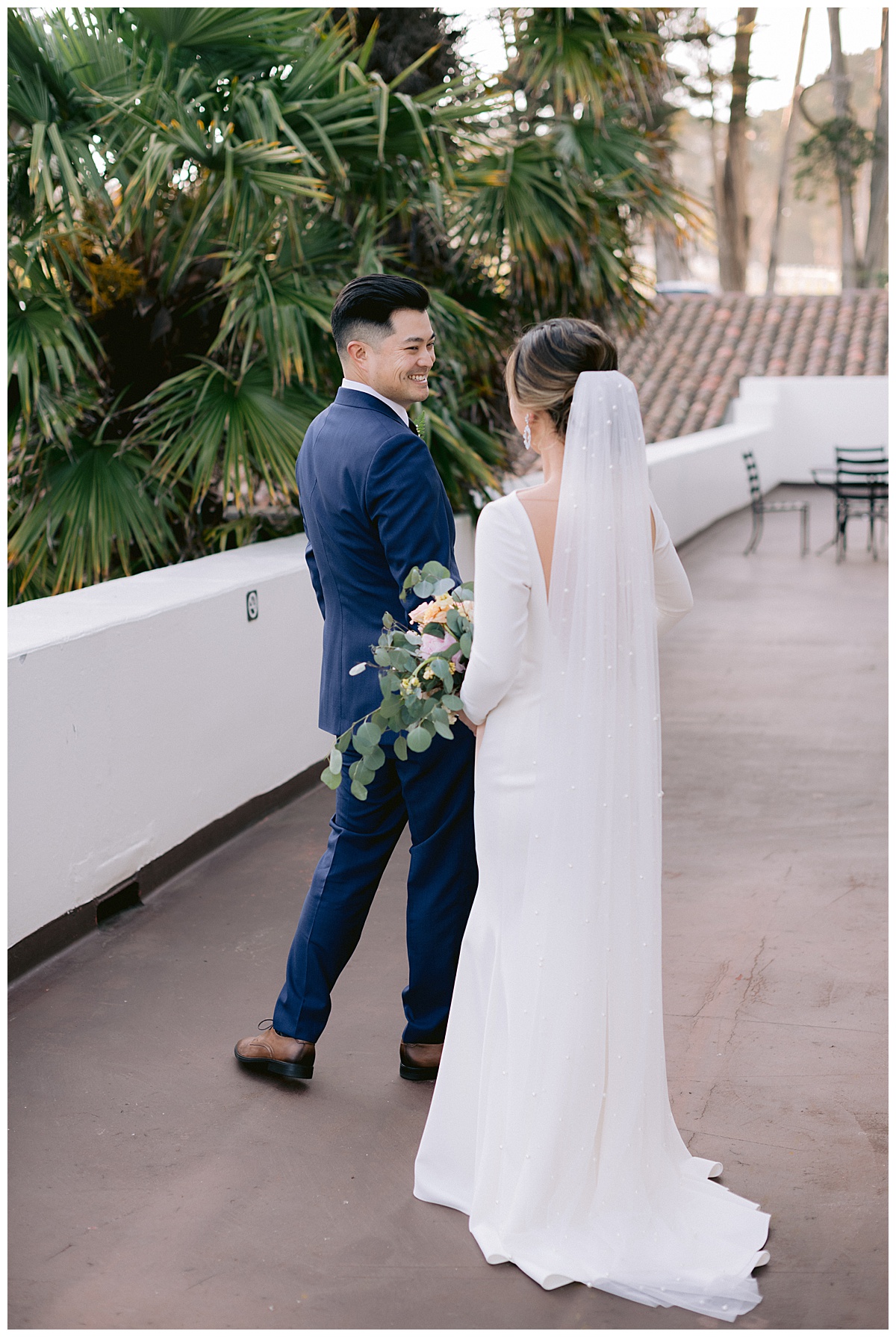 Vivian and Edwards first look before their outdoor Presidio Chapel wedding