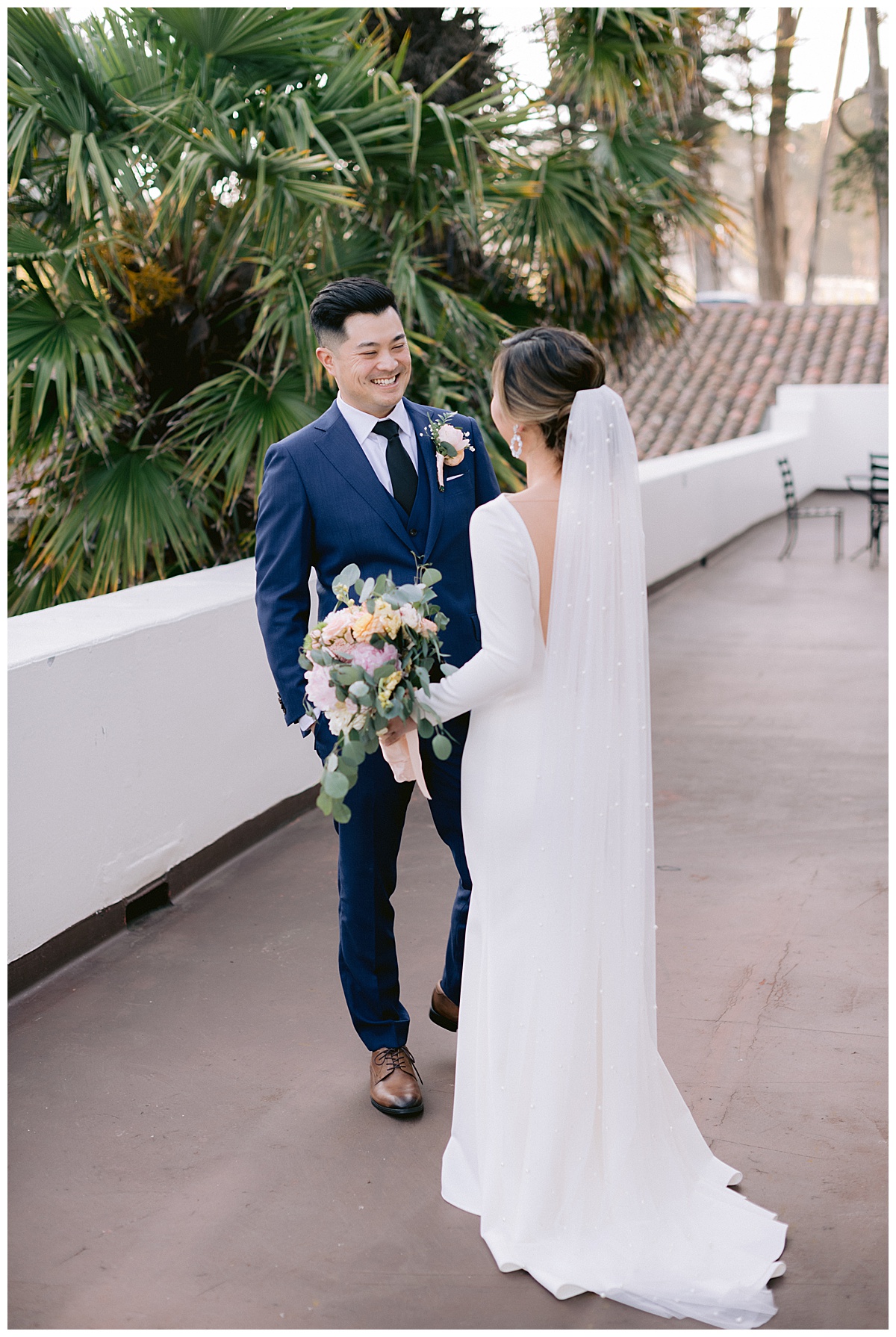 Vivian and Edward's first look before their outdoor Presidio Chapel wedding ceremony
