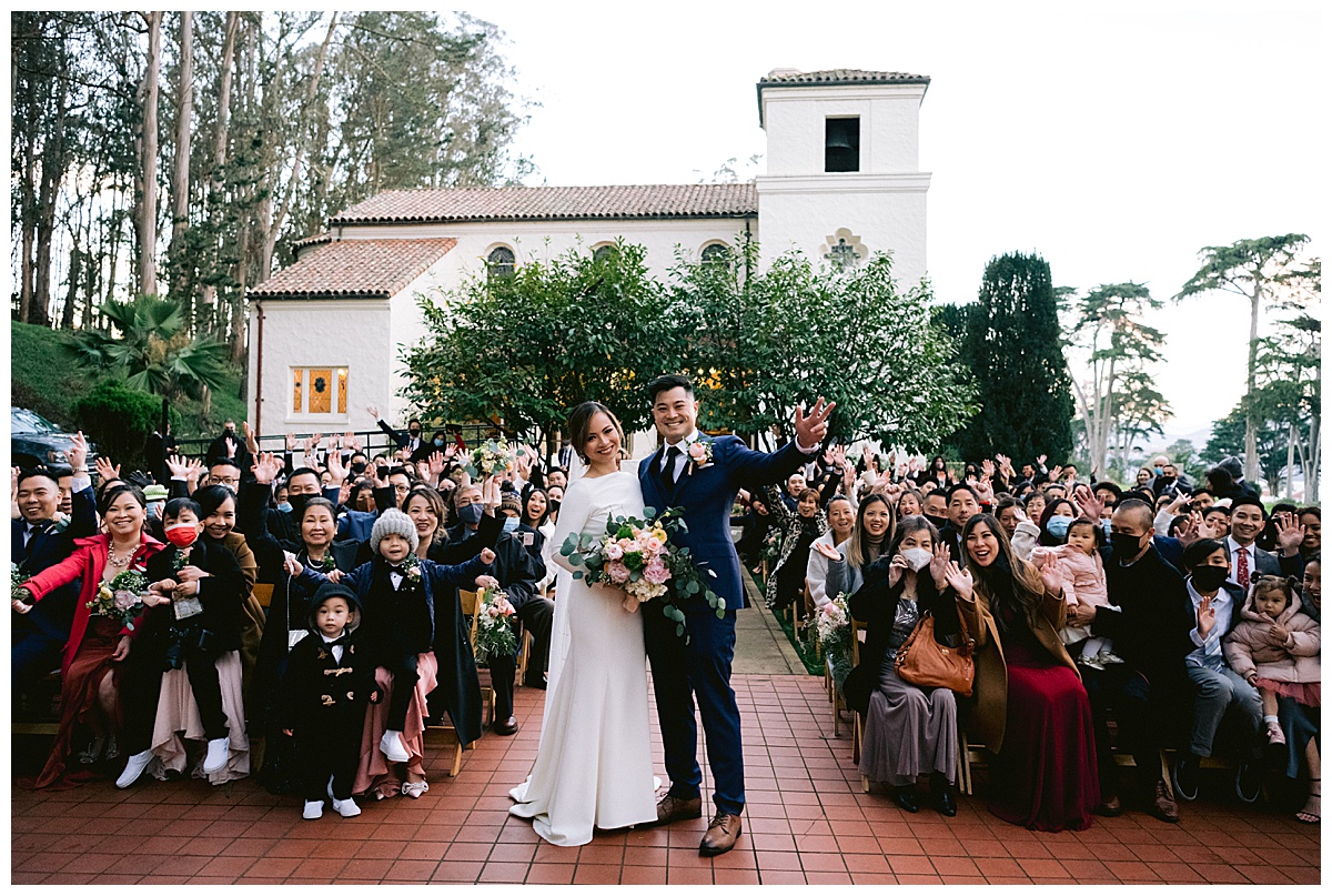 Vivian and Edward with their wedding guests