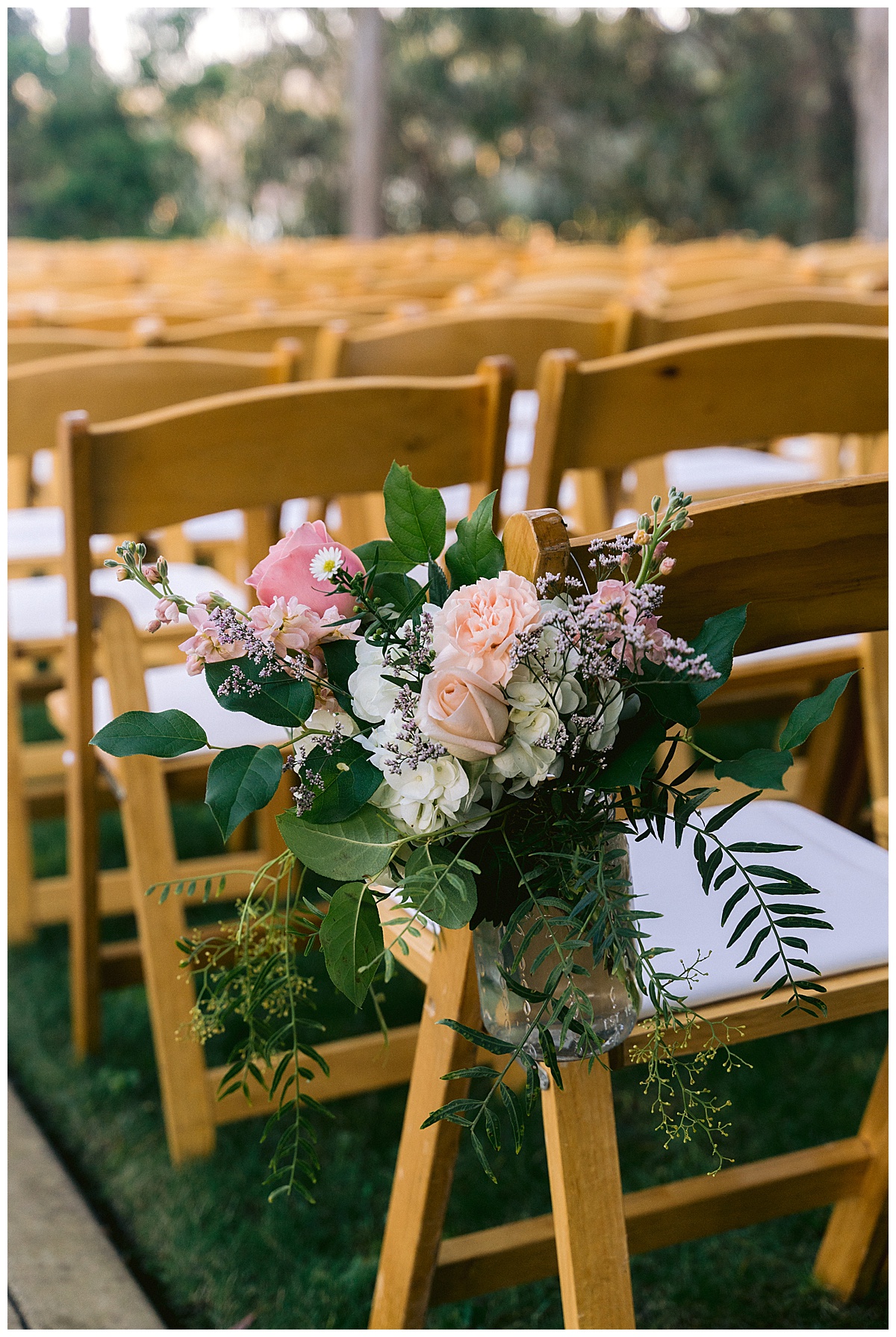 Rose floral decor on ceremony seats