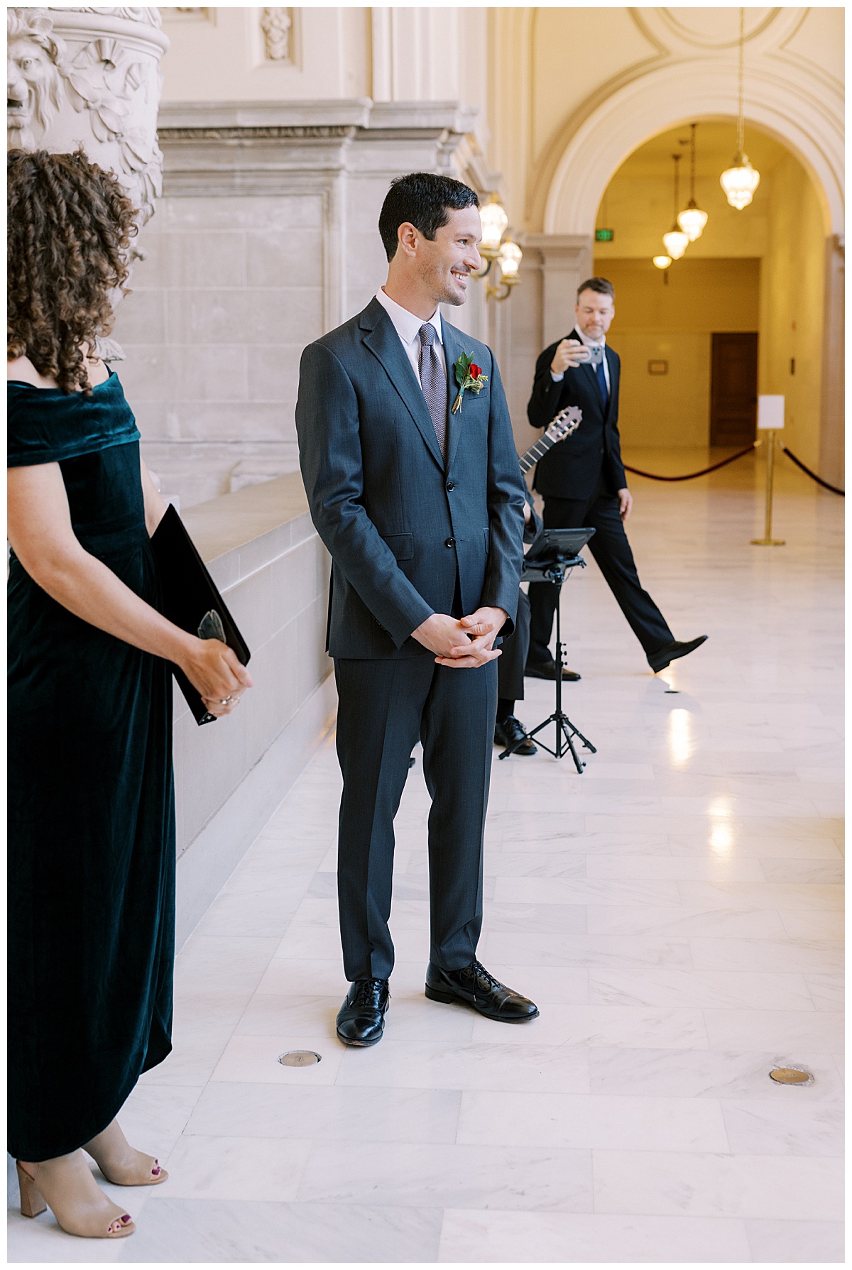 Nick waiting for Hillary for their vintage glam SF City Hall wedding