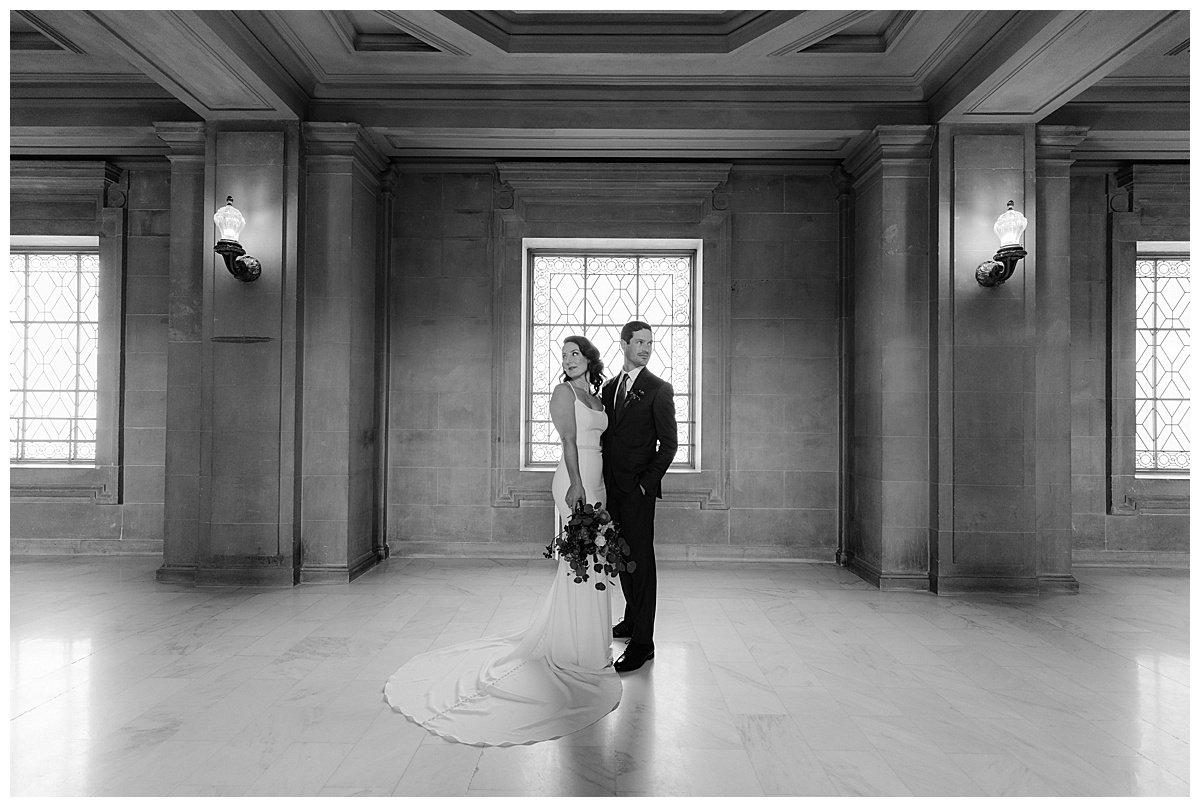 Black and white photo of Hillary and Nick in SF City Hall