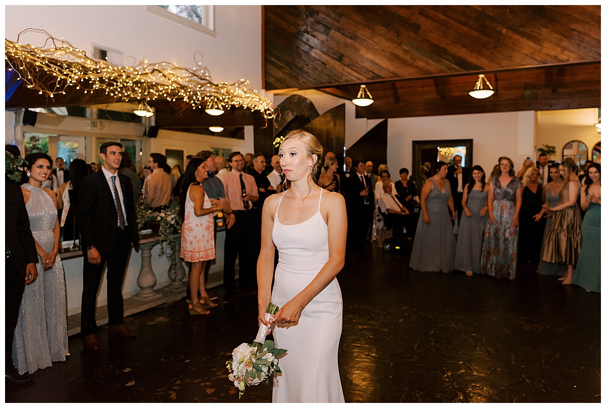 bridal bouquet toss during reception at Hans fahden