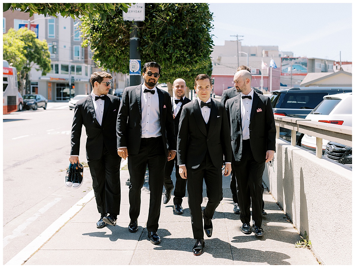 groomsmen walking in the street in San Francisco