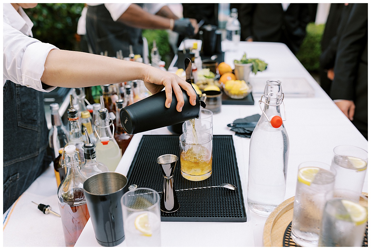 cocktail being poured at flood mansion wedding reception