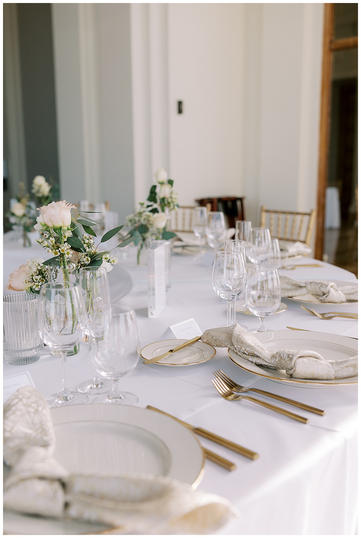 gold and white wedding reception dinner table details