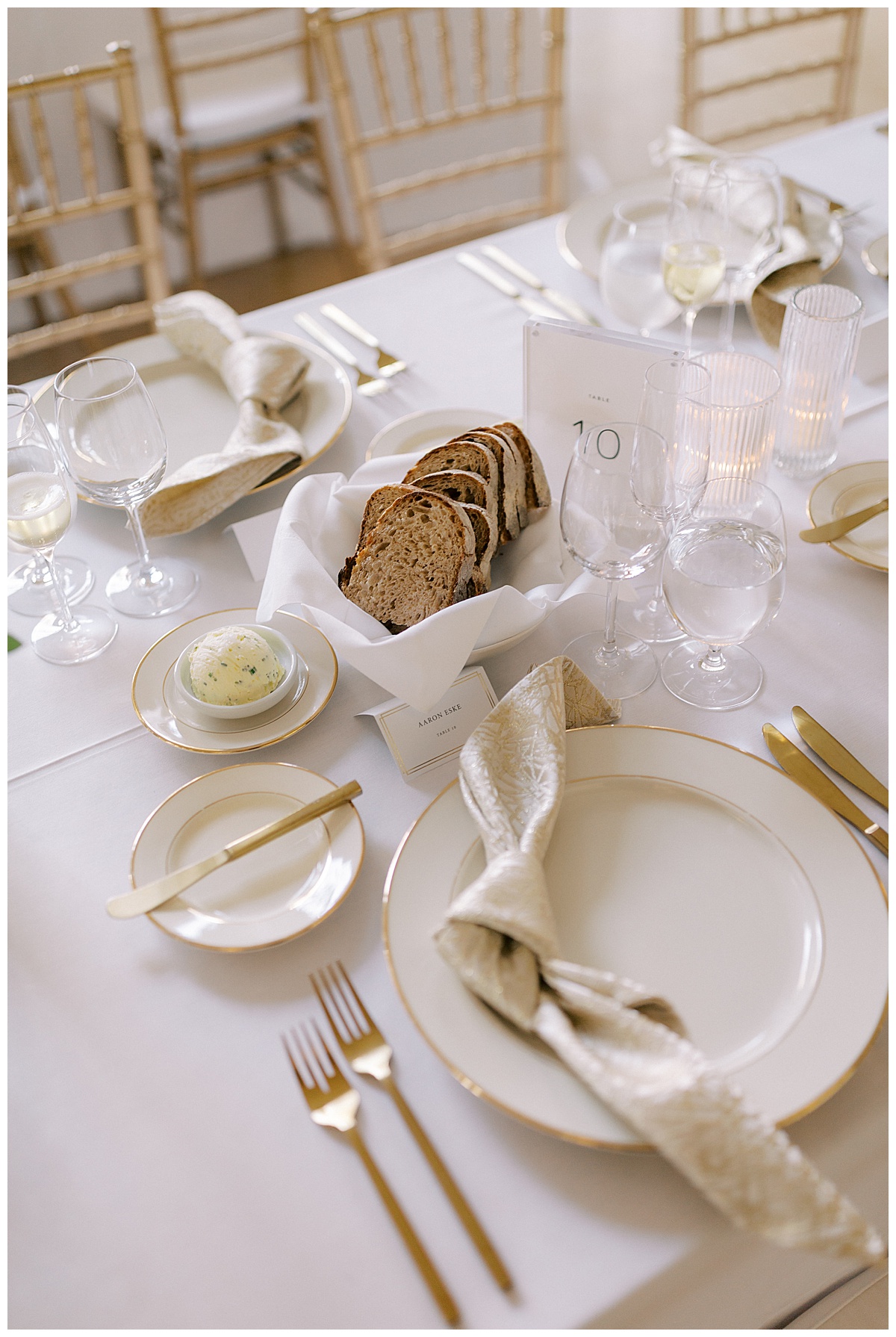 gold and white wedding reception dinner table details