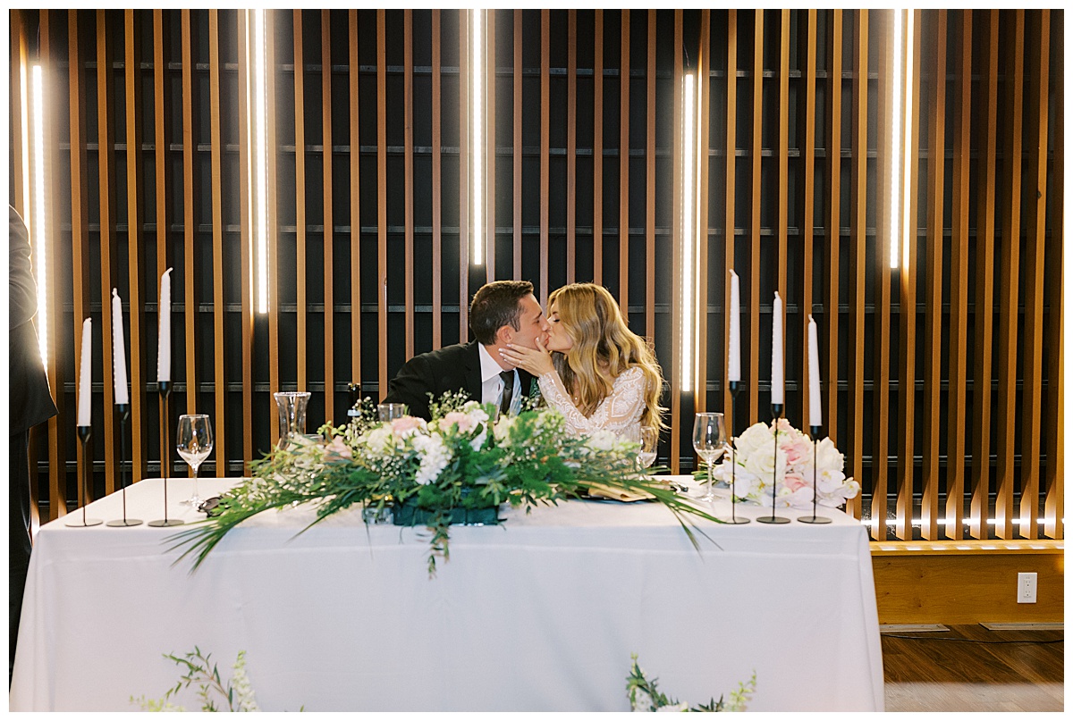 monterey-wedding-photography-sweetheart-table-kiss.jpg