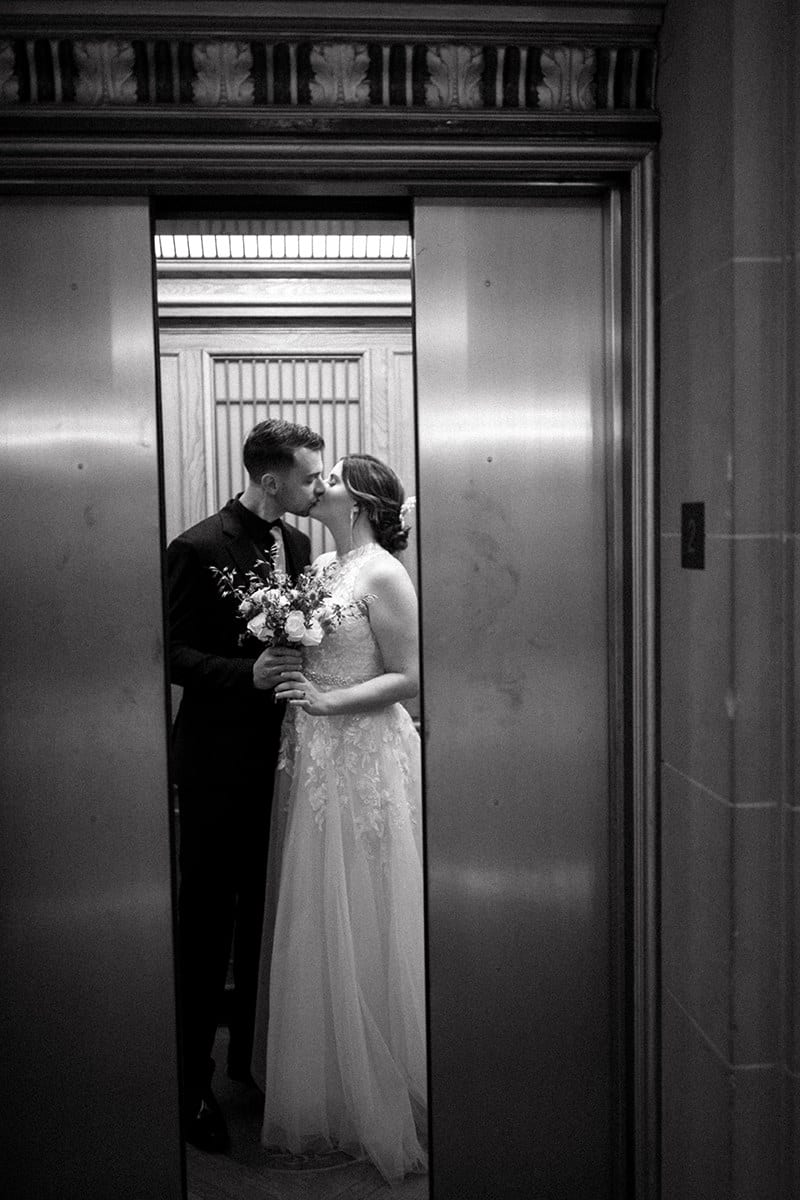 Couple kissing in sf city hall elevator