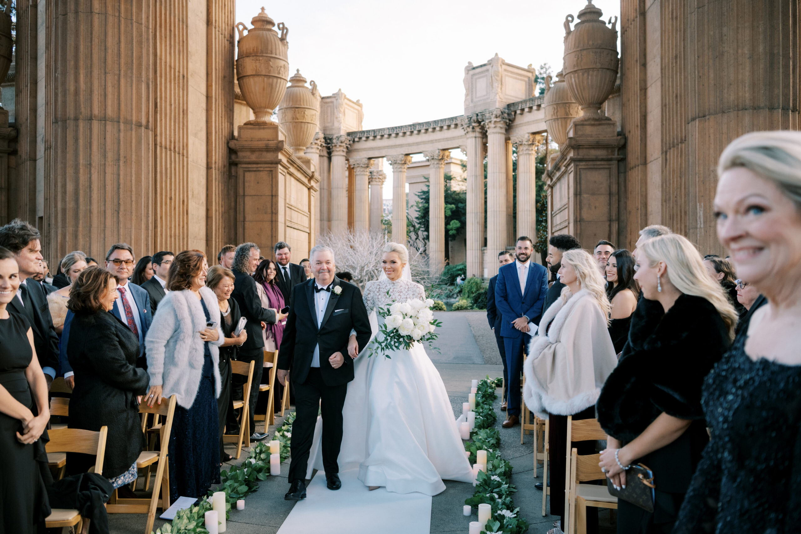 bride ascending the aisle with father