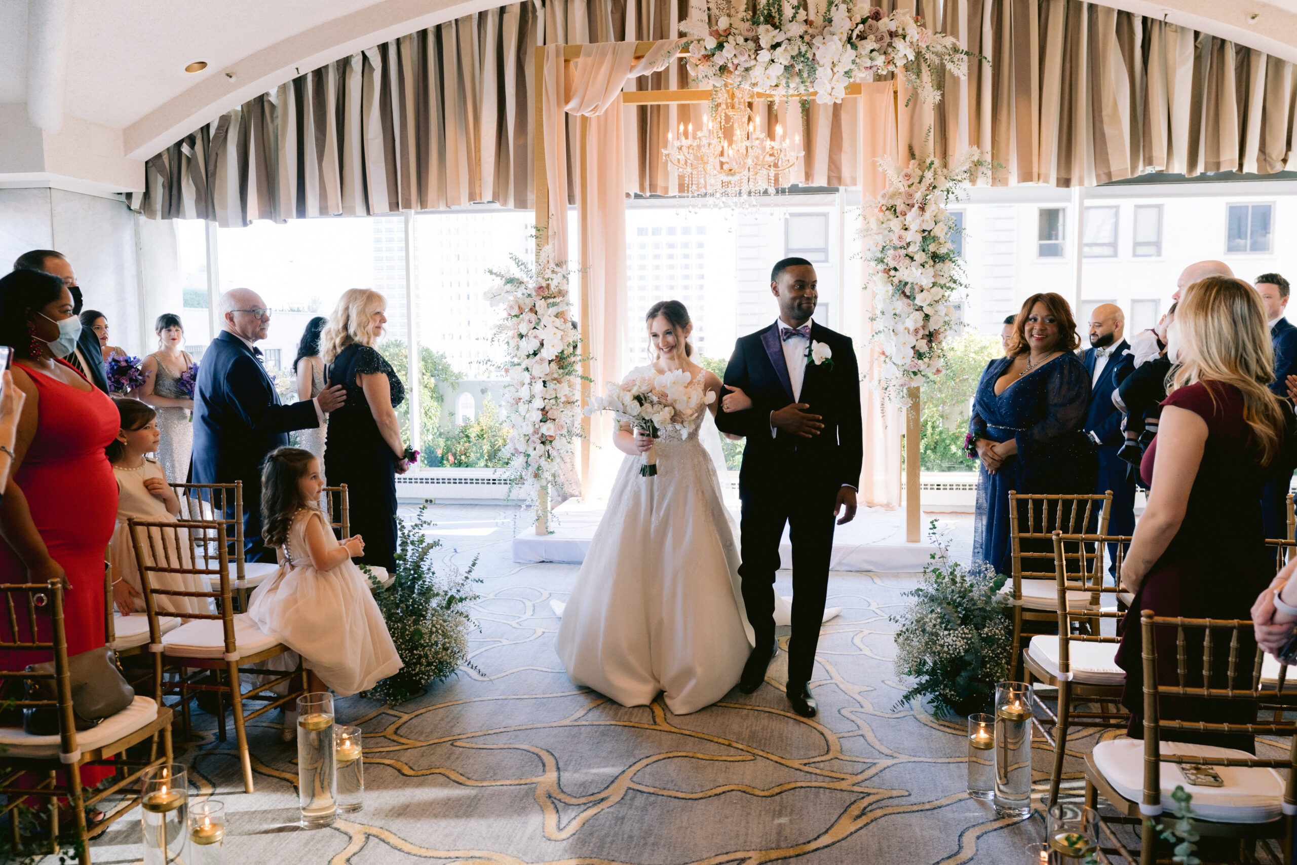 newly married couple walking back down the aisle 