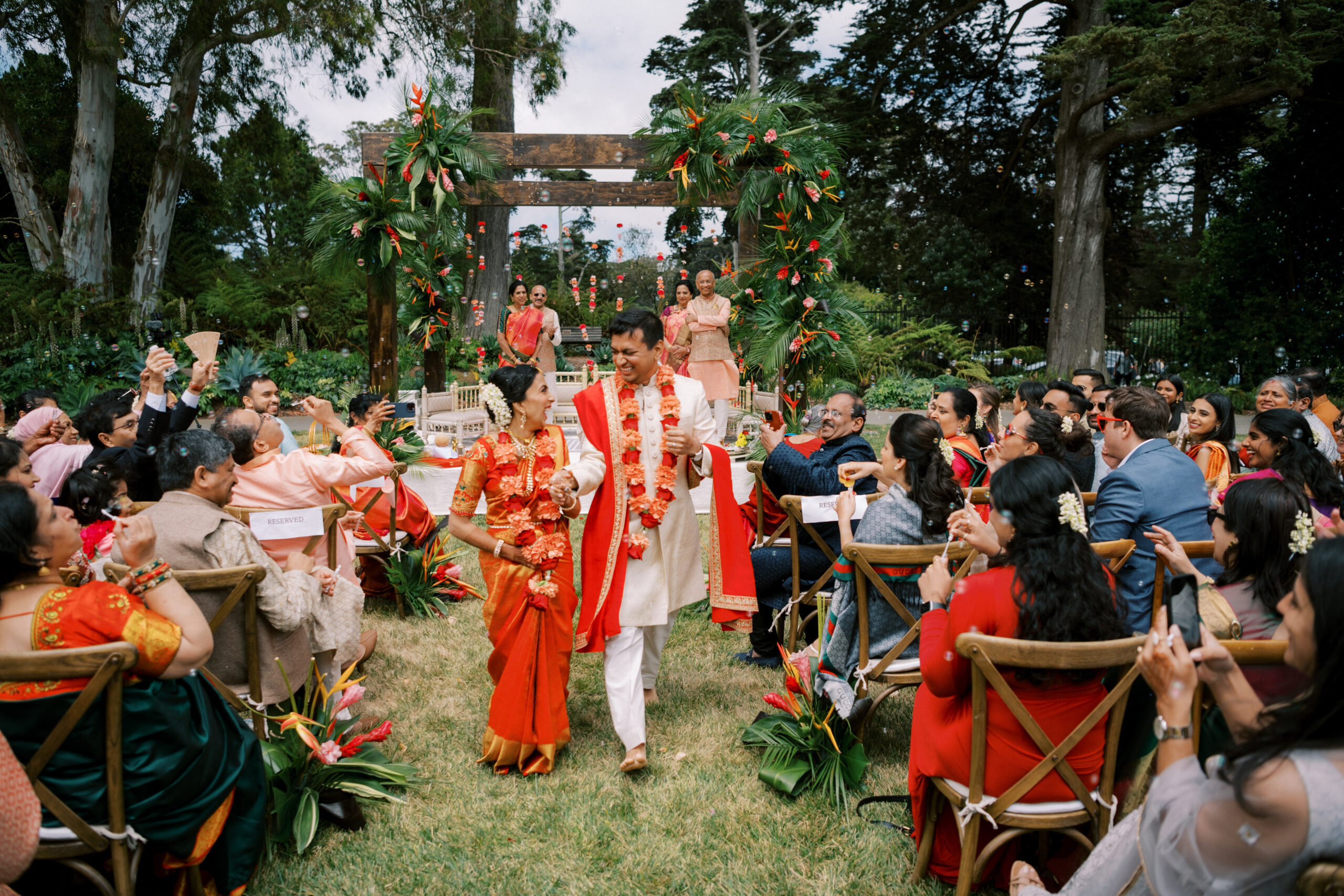 couple coming back down the isle after wedding ceremony 