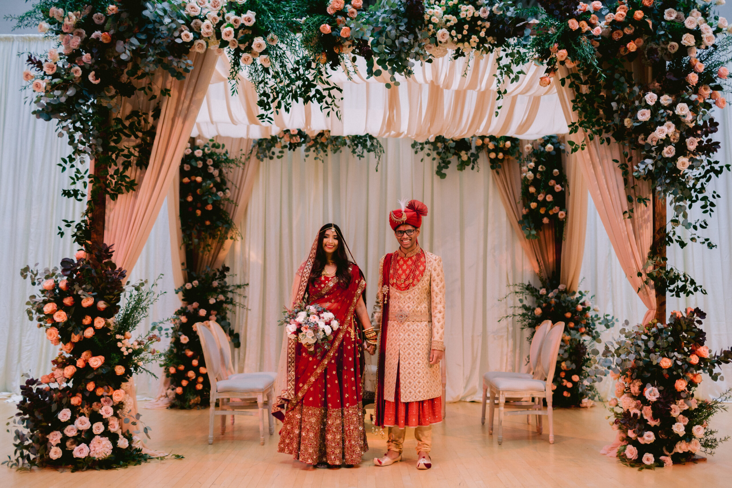 married Indian couple standing on mandal