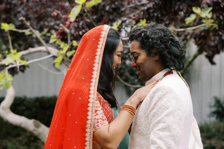 Indian wedding couple with foreheads touching