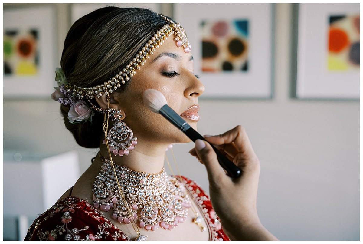 bride getting makeup done