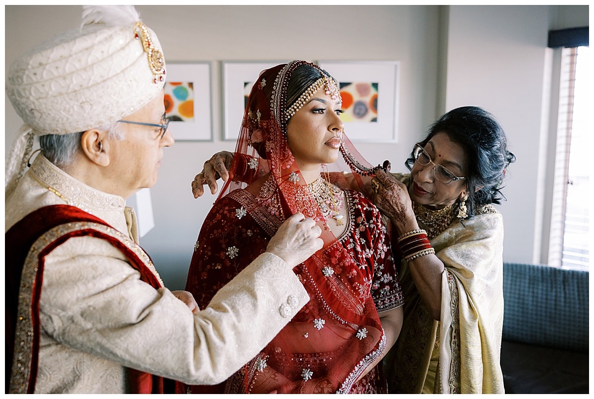 parents helping bride get ready